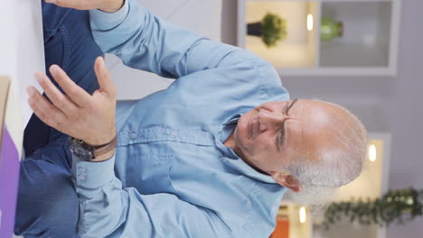 Vertical-video-of-The-old-man-arguing-with-his-girlfriend-is-desperate-on-the-end-of-the-phone.